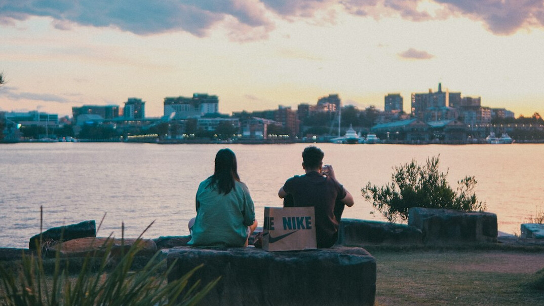 people in city park at dusk