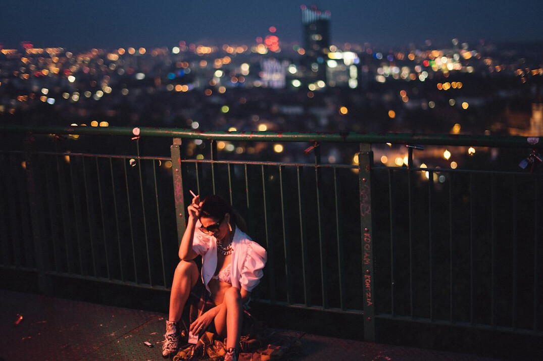 couple embracing under city lights