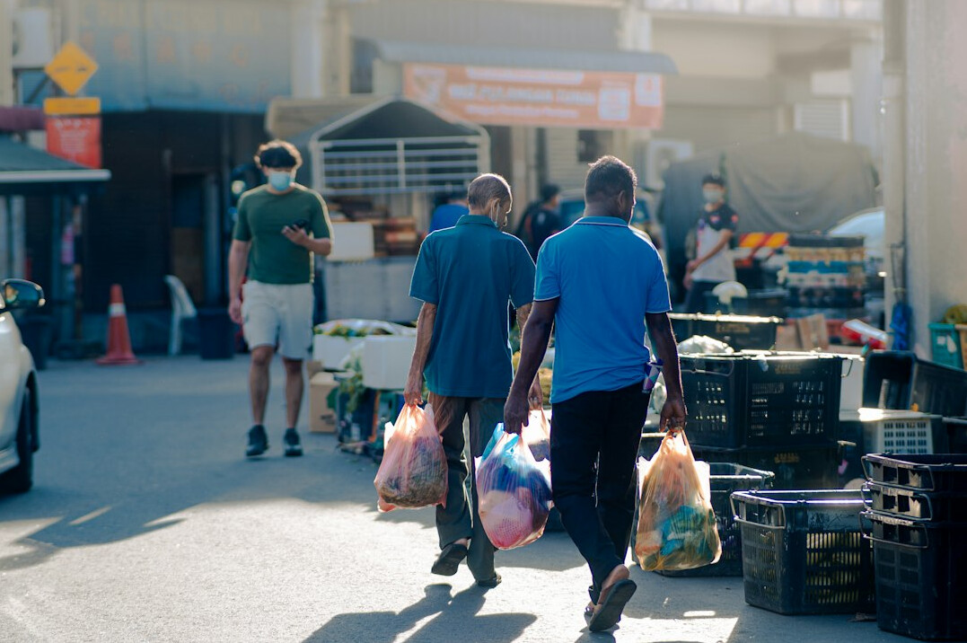group of neighbors helping with groceries